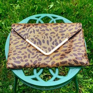 Bebe chain mesh metal clutch leopard